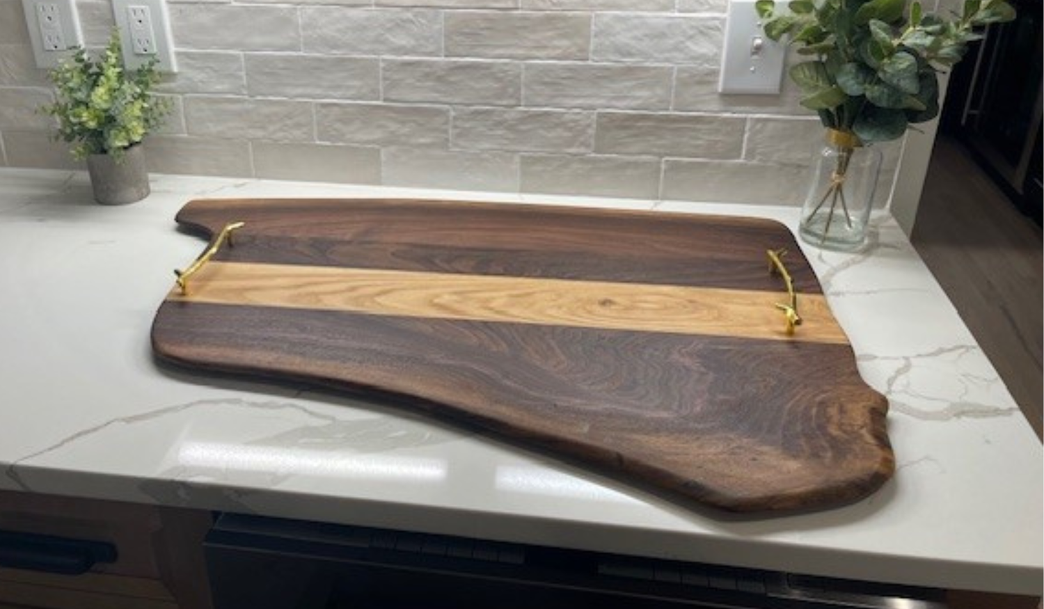 Solid wood charcuterie board with natural grain, handcrafted by Hoeksema Woodworking