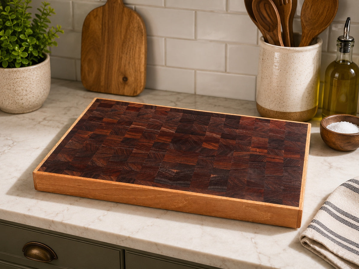 Handcrafted hardwood cutting board by Hoeksema Woodworking staged on a kitchen counter