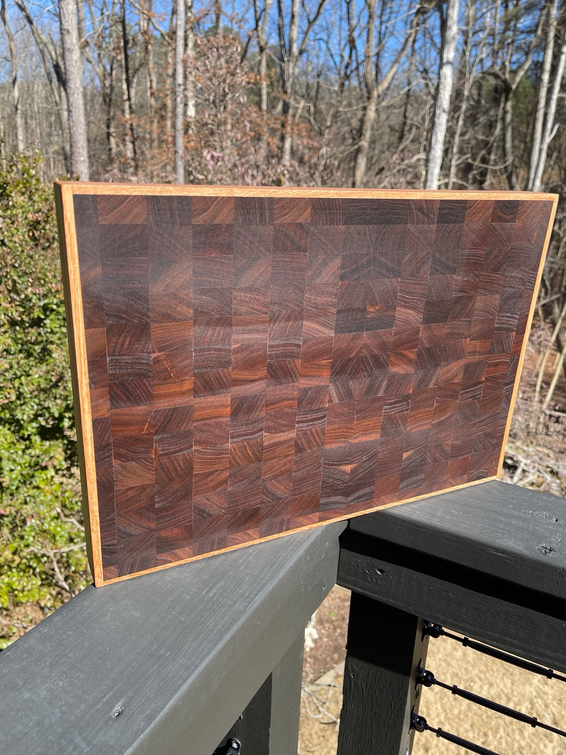 Close detail of handcrafted end grain cutting board showing the natural block grain pattern