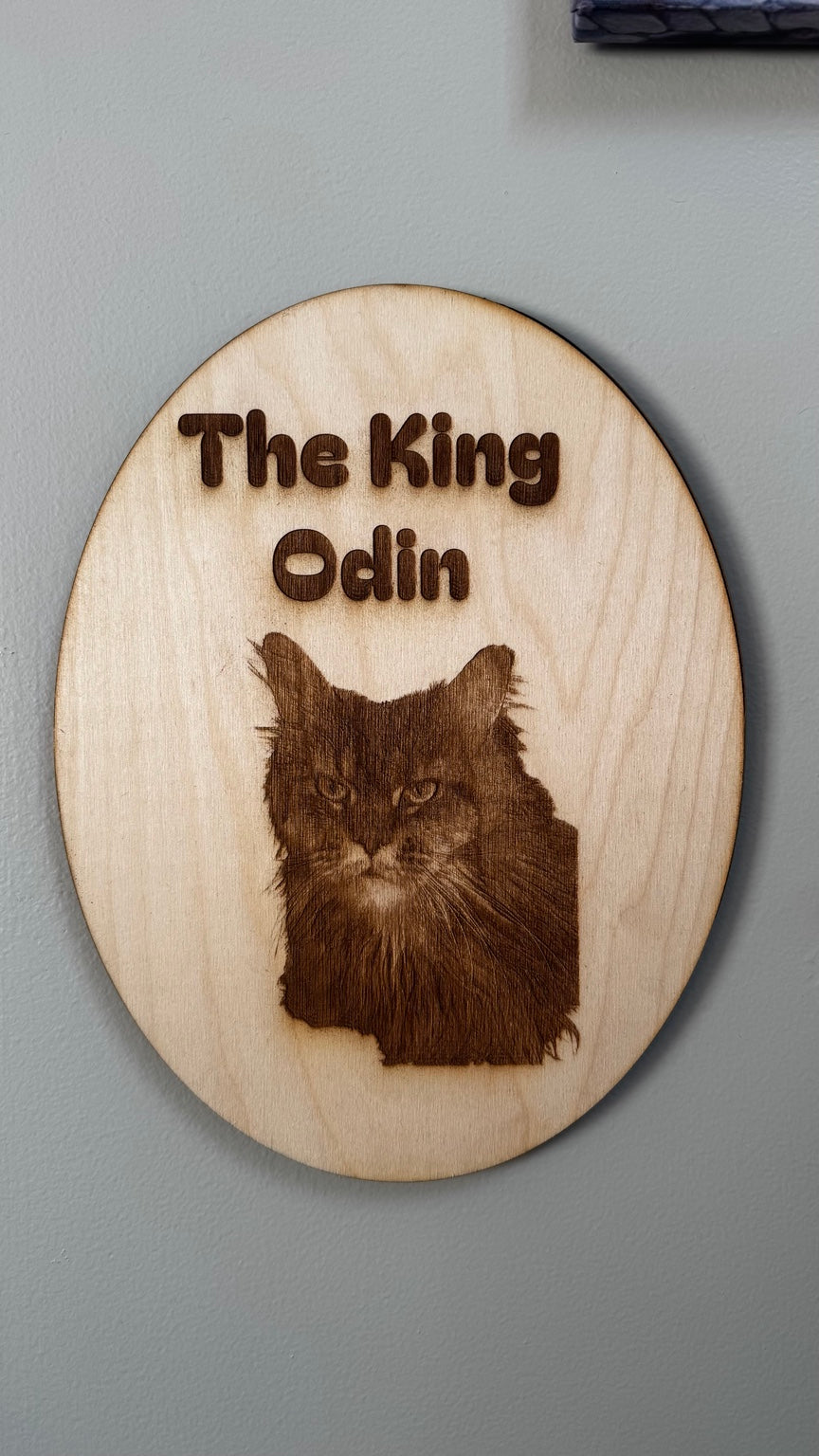 The King Odin custom pet portrait engraved on a round wood keepsake